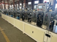 Machine automatique de découpe et de perforation pour la fabrication de protège-coins en carton