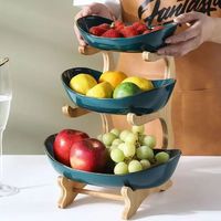 Minimalistische design drie-laags ronde houten fruitschaal met 2-3 liter capaciteit voor gebruik in de woonkamer en keuken, draagbare opbergoplossing voor servies.