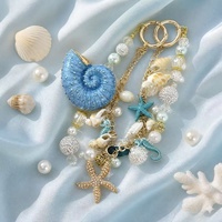 Lujoso Colgante de Sirena Oceánica con Cuentas, Concha, Estrella de Mar, Perla y Llavero Dorado para Teléfono, Hecho a Mano, Venta al por Mayor