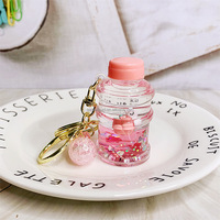 Porte-clés professionnel en acrylique rempli d'huile, mignon en forme de bouteille de glace, avec liquide lumineux, porte-clés liquides personnalisés pour enfants
