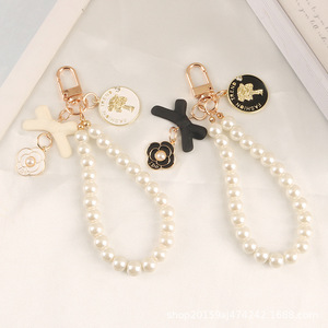 Nouveau arc porte-clés pendentif mignon perle chaîne beauté tête métal rond étiquette accessoires sac décoration - Product Image 4