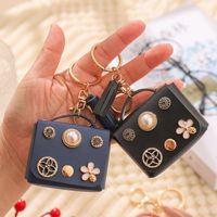 En gros Mini porte-monnaie, sac de rangement pour écouteurs Bluetooth et porte-clés européen