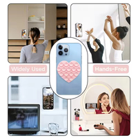 Support de téléphone en silicone à ventouse en forme de cœur pour grille d'aération de voiture