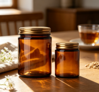 Vente en gros de pots cosmétiques en verre ambré avec couvercle en métal doré, contenants en verre vides pour bougies et crèmes, plusieurs tailles