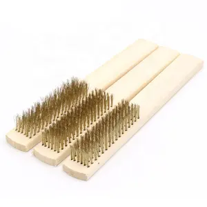 Small brass wire brushes with wooden handle