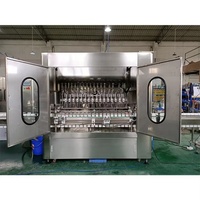 Ligne de remplissage d'alcool automatique électrique contrôlée par PLC de haute précision pour bouteilles en verre de vin et de whisky avec une rigidité élevée