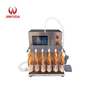 Machine de remplissage de sac de poche à bec de jus de qualité alimentaire à une tête Machine de remplissage scellage de sac debout pour Sopu chaud - Product Image 1
