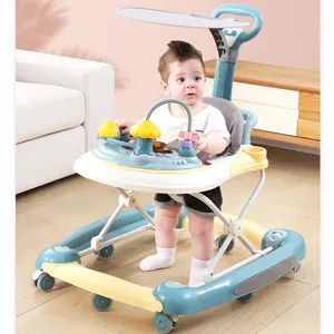 婴儿学步车儿童婴儿学步车有趣的玩具在桌子上学会了用塞子走路