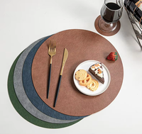Vente en gros Nouveau style de tapis de table Nuoxin sets de table ronds double face en similicuir avec logo personnalisé