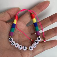 Bracelets de perles de mode transfrontalière noir blanc arc-en-ciel argile douce tissée avec logo de lettre anglaise noeud plat Style noeud péruvien