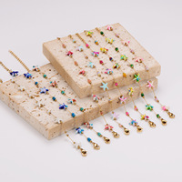 Ensemble de bijoux classique en acier inoxydable plaqué or 18 carats avec collier et bracelet ajustables, style océan et plage, pour femme