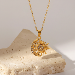 Elegante colgante de sol y luna dorado con piedras brillantes, que representa la armonía y el amor, ideal para ocasiones especiales. - Product Image 1