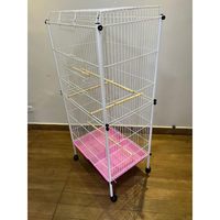 Volière verticale en métal avec porte supérieure, perchoirs en bois à niveaux, roulettes mobiles pour un placement flexible dans les pièces de la maison