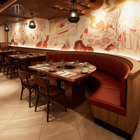Ensemble de mobilier moderne et durable pour restaurant commercial : banquette demi-cercle avec structure en bois et revêtement en cuir, table, chaise et canapé pour restaurant de fondue