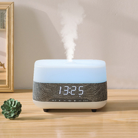 Diffuseur d'huile essentielle, haut-parleur d'horloge domestique diffuseur d'arôme humidificateur ultrasonique à brume froide avec fonction de lecteur de musique