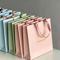 Sac fourre-tout robuste de 6 à 9 kg en carton blanc, avec logo personnalisé, texture élégante pour usage commercial haut de gamme