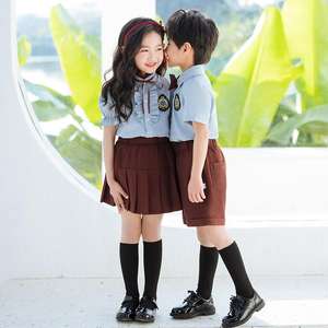 ชุดนักเรียน OEM เสื้อเชิ้ต<span class=keywords><strong>สี</strong></span>น้ำเงินปักลายพร้อม<span class=keywords><strong>กางเกง</strong></span>ขาสั้น<span class=keywords><strong>สี</strong></span><span class=keywords><strong>น้ำตาล</strong></span>และกระโปรง ชุดนักเรียนมัธยมต้น - Product Image 3