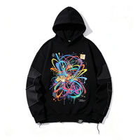 Sweat-shirt à capuche Raw Edge Kornit DTG avec imprimé graffiti vibrant, panneaux superposés, détails déchirés, coupe oversize, style streetwear