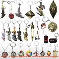 Porte-clés en métal assortis à la mode pour produits liés aux jeux, avec pendentif design logo couteau, vente en gros en vrac
