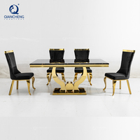 Ensemble de table à manger en marbre et acier inoxydable pour la salle à manger des maisons, avec 6 chaises