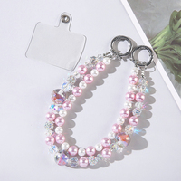 Dragonne de luxe portable et durable en alliage de zinc et plastique, ornée de perles de cristal, avec double chaîne, pour téléphone portable, porte-clés, étui de sac et dragonne de poignet