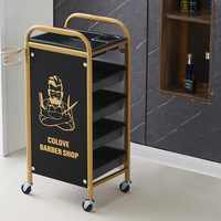 Chariot de rangement roulant 4 niveaux or et noir pour salon de coiffure, avec support pour sèche-cheveux, pour salon masculin