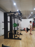 Équipement de gymnastique à domicile de haute qualité entraîneur d'exercice tout en Qne formateur multifonction Fitness équipement de gymnastique Commercial Smith Machine
