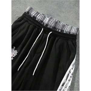 Pantalon de survêtement ample pour homme, coupe large, taille élastique avec cordon de serrage, style streetwear, avec bande latérale, respirant, en polyester et coton - Product Image 1