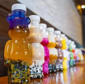 MAYSURE Diseño de Moda Atractivo 350ML Botella de Plástico con Forma de Oso para Bebidas Leche Té Jugo Miel con Tapón de Rosca