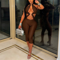 Combinaison moulante sexy ajourée pour femme avec anneaux métalliques et bandage, idéale pour les soirées, clubs, raves et festivals