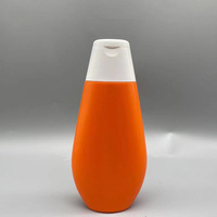 Emballage cosmétique pour soins de la peau, flacon en plastique HDPE de couleur orange de 200 ml et 400 ml avec bouchon à rabat pour lait corporel et crème
