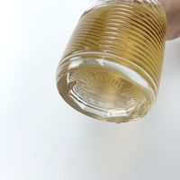 Bouteille d'alcool en forme d'olive avec motif gravé
