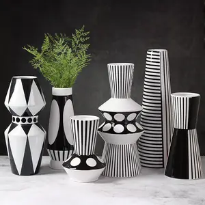 Fabricación de jarrones de cerámica geométricos creativos modernos jarrones a rayas blancas y negras