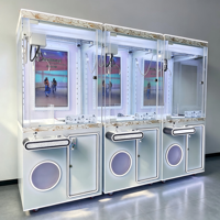 Machine à griffes commerciale avec écran de lecture vidéo, lumières LED, commande par joystick et cabine de récompenses à monnayeur