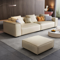 Ensemble de canapés modulaires surdimensionnés Cloud avec tissu bouclé crème et structure en bois massif robuste pour les espaces de vie modernes et spacieux