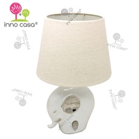 Lampe de table pour enfants en forme d'éléphant avec base en céramique et porcelaine, abat-jour en tissu, placage argenté, lumière décorative électrique pour enfants