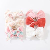 Accessoires pour cheveux en coton mousseline 100% avec des imprimés floraux en nylon de différentes couleurs et un nœud élastique pour les tout-petits