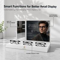 Expositor de Mostrador Blanco Brillante para 3 Pares de Gafas con Espejo de Prueba Integrado, Panel de Cartel Intercambiable y Soporte Flexible para Gafas