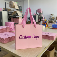 Sacs en papier personnalisés pour cosmétiques et vêtements, sacs de shopping en papier de luxe personnalisés de couleur rose