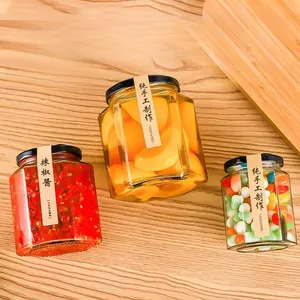 Venta al por mayor personalizado Hexagonal 45ml 100mL 380Ml 500ml frascos de miel de vidrio vacíos transparentes almacenamiento de alimentos de vidrio con tapas de rosca para encurtidos