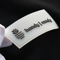 Insigne en silicone avec design personnalisé étiquette en PVC 2D 3D gaufré fer à repasser étiquette en caoutchouc pour vêtements, entretien et lavage