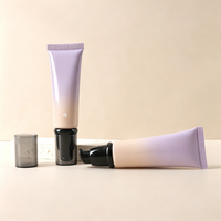 Tube souple rond en plastique noir personnalisé de 50 g, tube de 50 ml pour fond de teint et crème pour les yeux avec pompe sans air