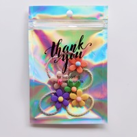 Bijoux cosmétiques transparents avec impression personnalisée et doux au toucher pochette scellée à fermeture éclair laser emballage plastique holographique sacs en mylar