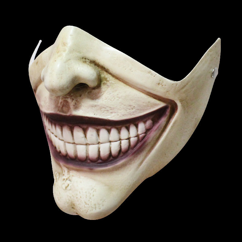 The lower half of the face is toothy, mask light beige