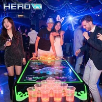 HEROVR Machine de jeu de divertissement à fort potentiel de profit, Table de pong interactive en acier inoxydable avec 16 couleurs LED et conception modulaire pour