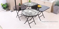Table à manger pliante en métal avec plateau en verre trempé, design simple pour balcon et usage domestique en extérieur