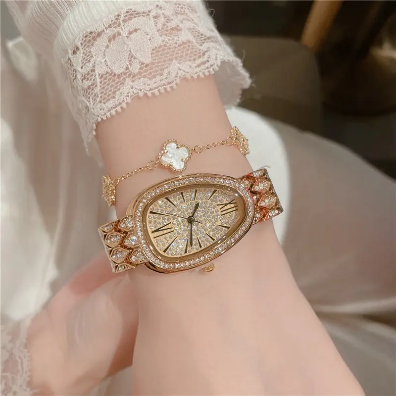 Jam tangan kepala ular E-03029 jam tangan kuarsa wanita High end sabuk jam tangan emas penjualan populer pinggiran silang