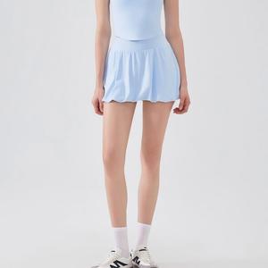 Jupe de tennis taille haute pour femme avec ourlet bouffant, short intégré et poches latérales, séchage rapide, anti-transparence, idéale pour l'entraînement (vente en gros) - Product Image 1