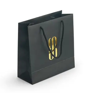 Bolsas de papel negro con diseño de impresión personalizada, logo de impresión en caliente dorado