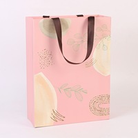 Sac en papier cartonné blanc avec logo personnalisé, UV sélectif et laminé sans pli de taille